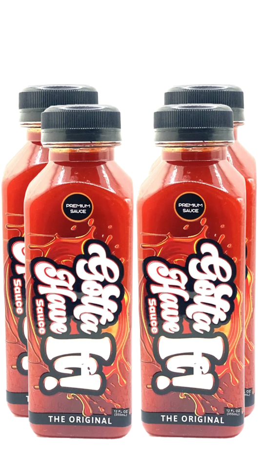 Four bottles of Gotta Have It! Sauce on a white background